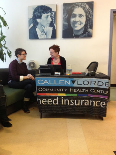 Mallory Mahoney, Insurance Navigator (l)  chat with Lauren Clapp (r)  Supportive Care Case Manager discusses the process of getting an HIV+ client additional financial assistance through the ADAP/APIC program.